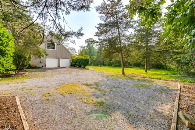 a view of a swimming pool with an outdoor space and seating area