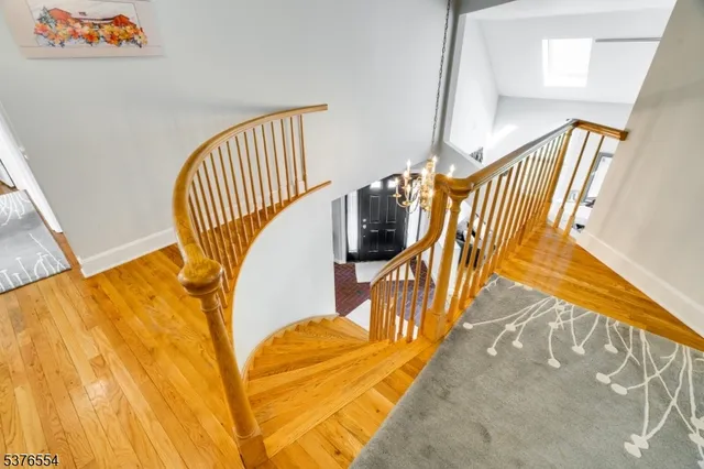 a view of a dining room and hall with furniture and floor to ceiling window
