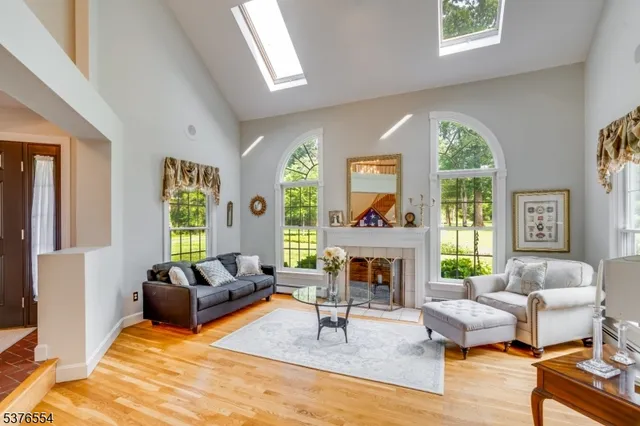 a kitchen with stainless steel appliances granite countertop a stove a sink a refrigerator and cabinets