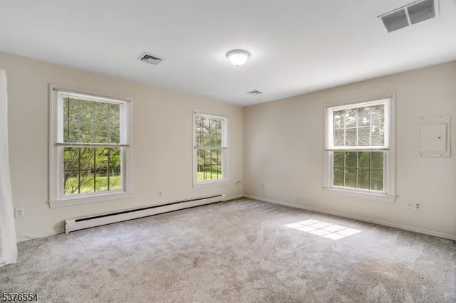 a bathroom with a sink a light fixture and a mirror