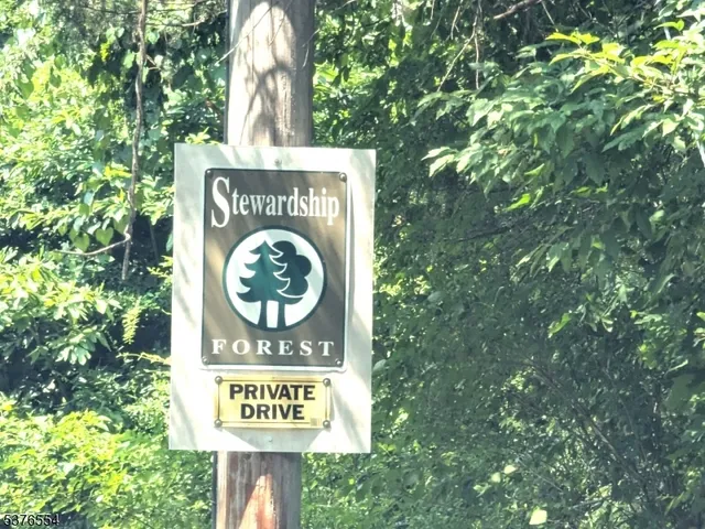 a sign that is sitting on a tree