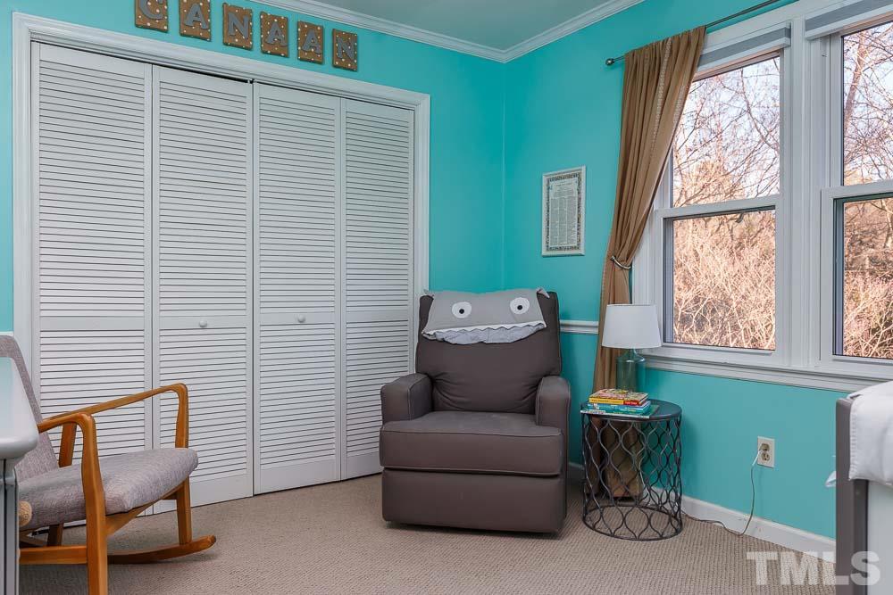 6932 Three Bridges Circle Raleigh, NC 27613 - Photo 18 of 25 a living room with furniture and a window