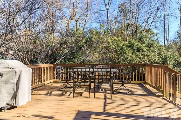 6932 Three Bridges Circle Raleigh, NC 27613 - Photo 21 of 25 a view of balcony with wooden floor and bench