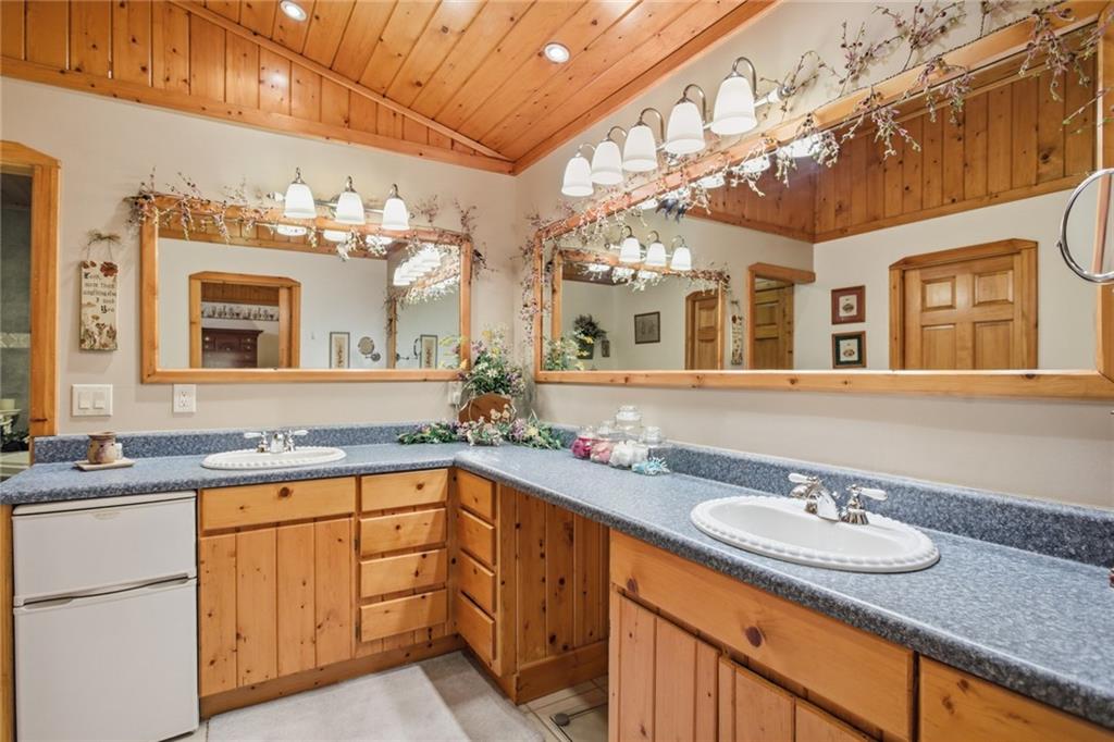 46 Spartan Lane Rabun Gap, GA 30568 - Photo 27 of 89 a bathroom with a granite countertop sink and a mirror