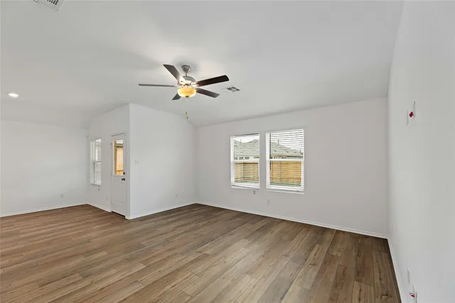 a kitchen with stainless steel appliances granite countertop a sink a stove top oven a counter space and cabinets