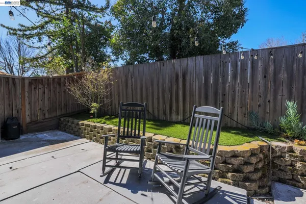 a view of two chairs in patio