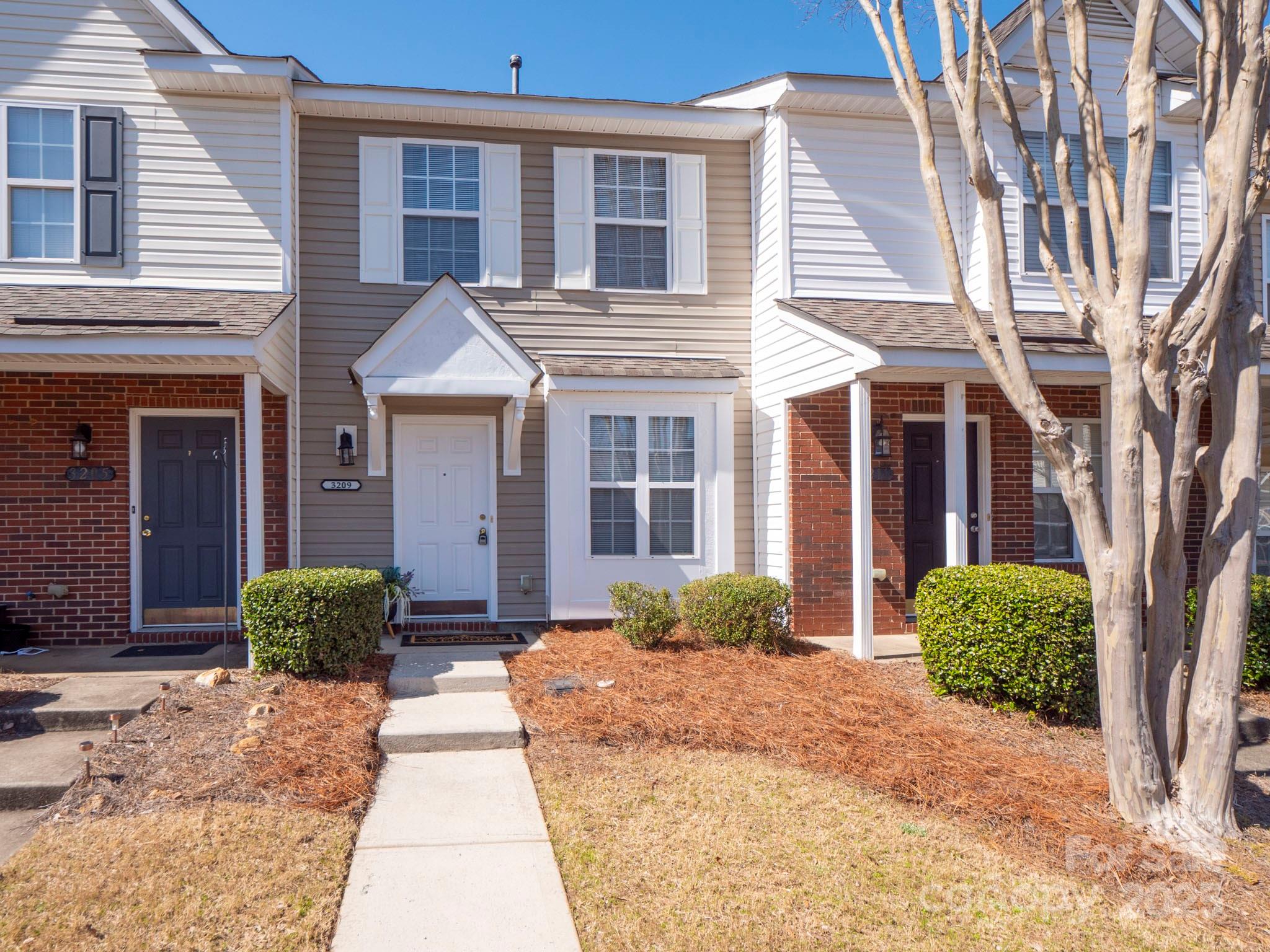 3209 Blythe Ridge Court Charlotte, NC 28213 - Photo 1 of 31 a front view of a house having yard