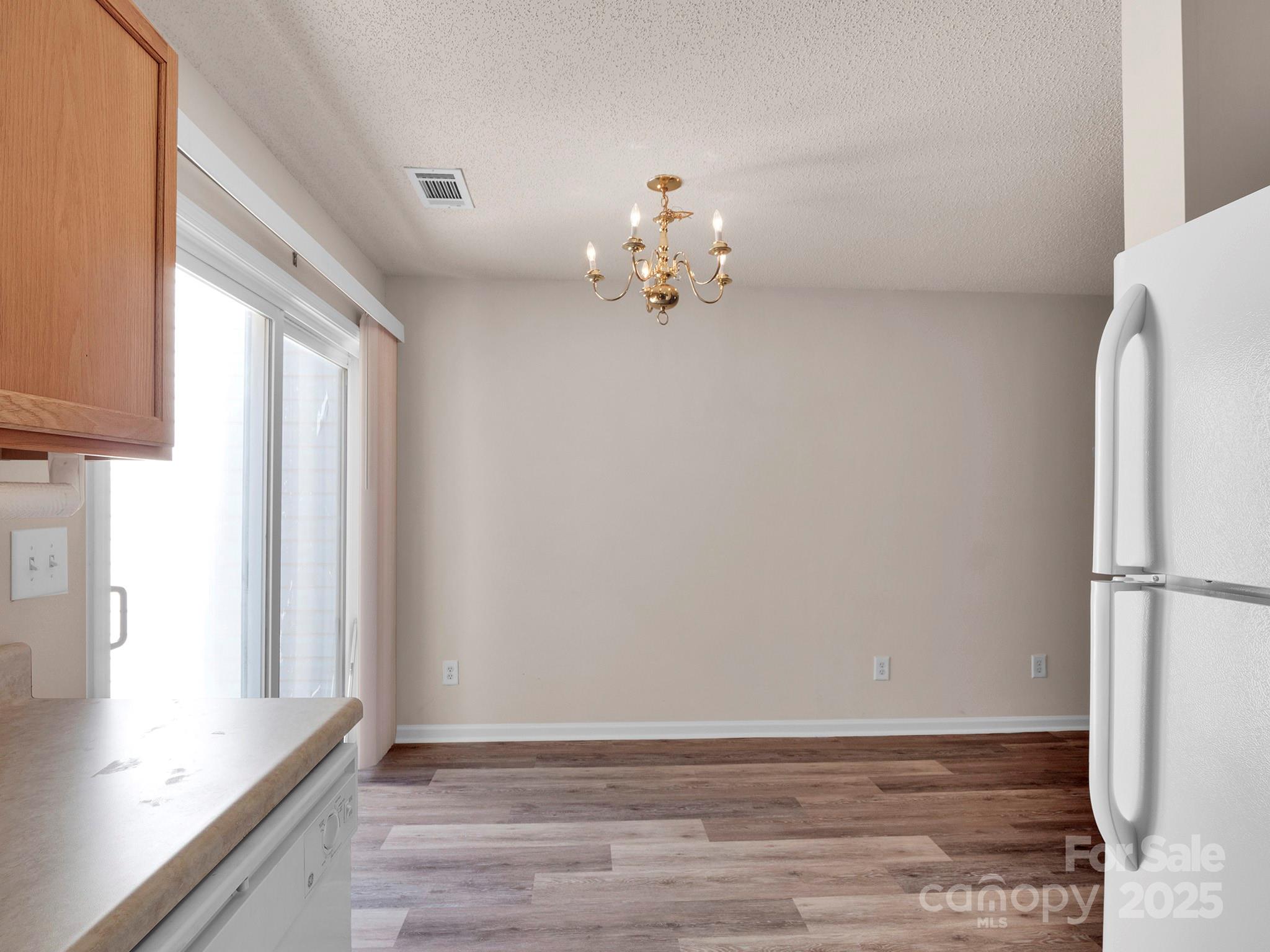 3209 Blythe Ridge Court Charlotte, NC 28213 - Photo 11 of 31 a view of kitchen with hardwood floor and a window
