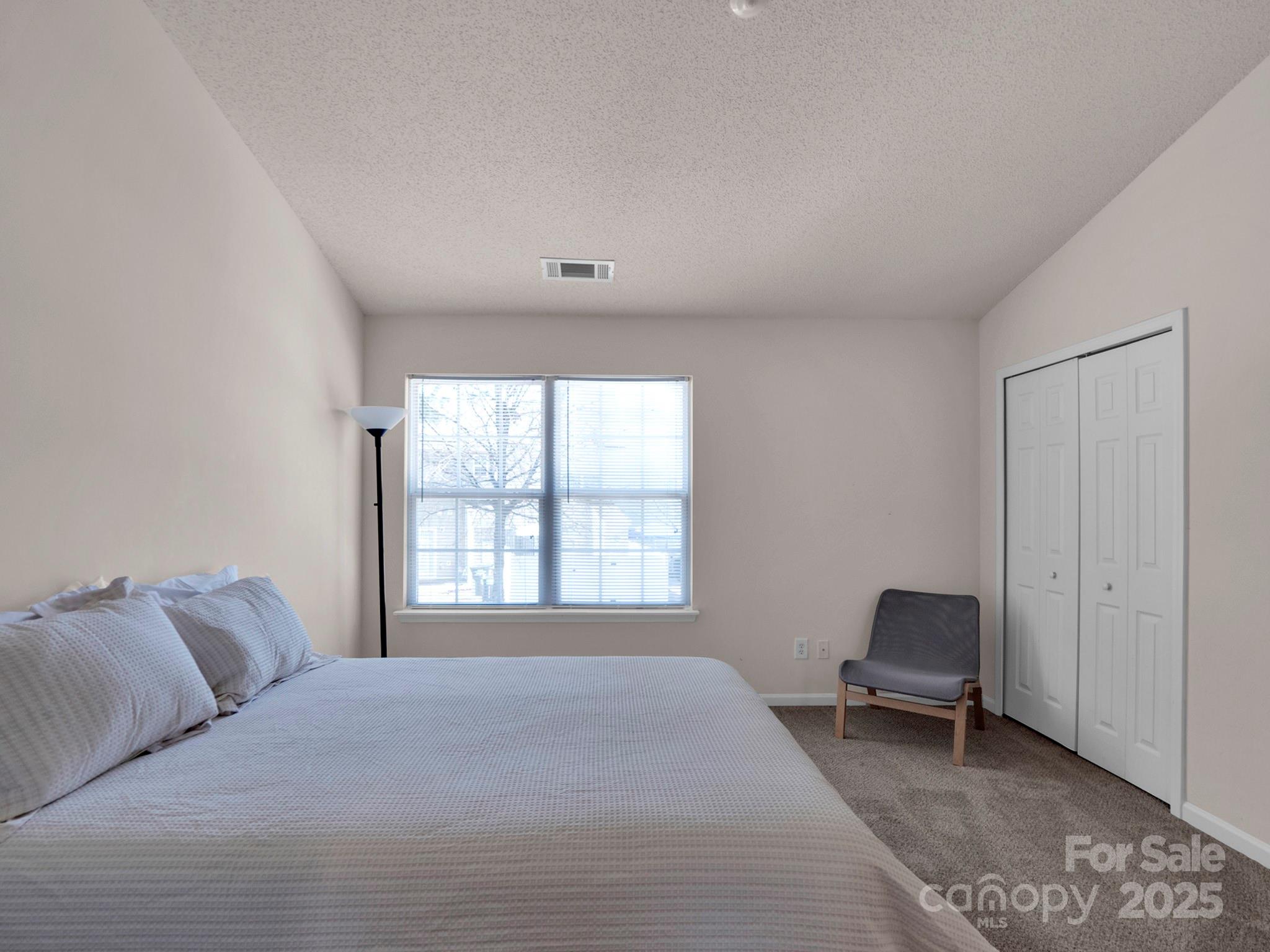 3209 Blythe Ridge Court Charlotte, NC 28213 - Photo 13 of 31 a bedroom with a bed and a window