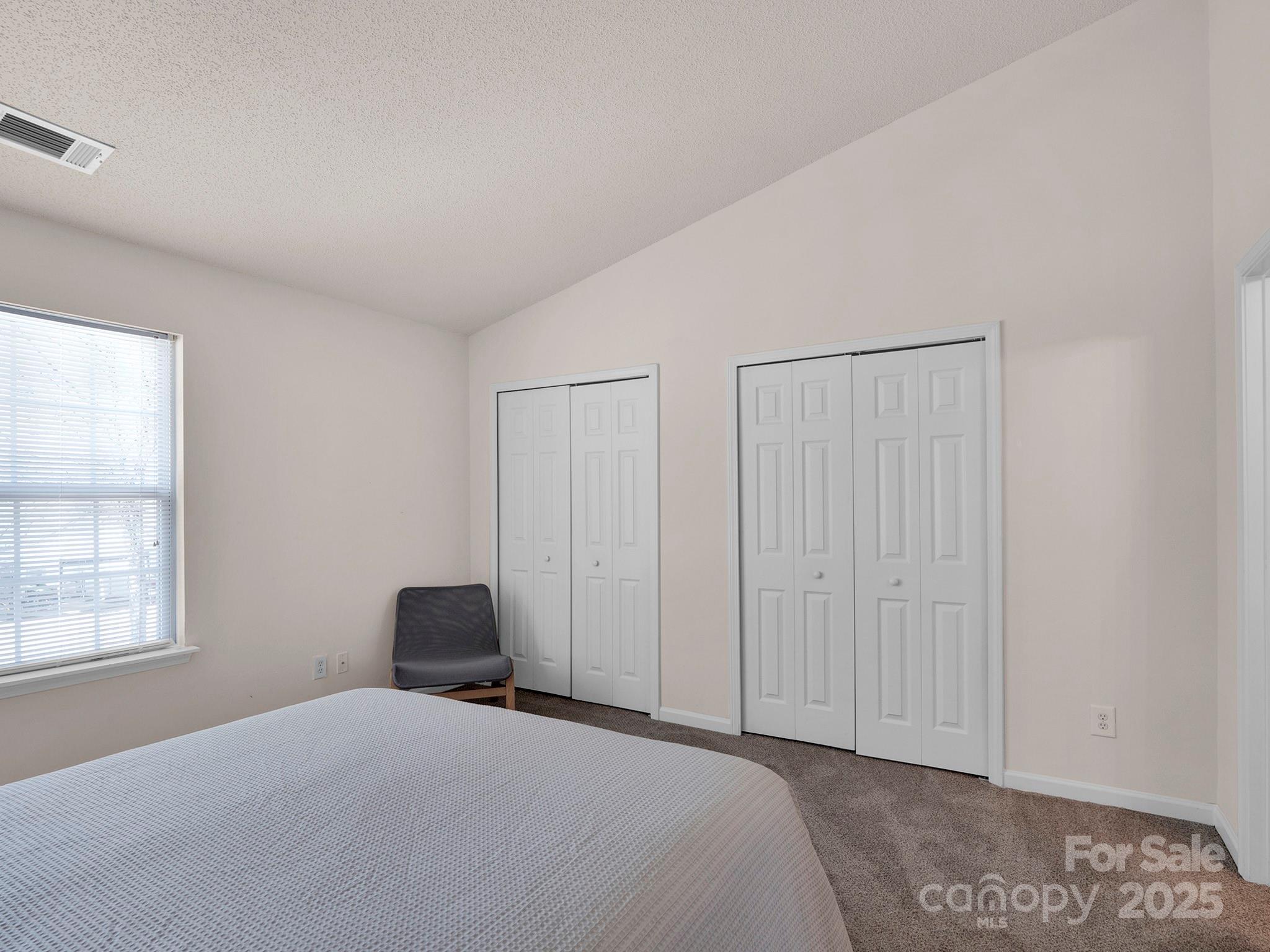 3209 Blythe Ridge Court Charlotte, NC 28213 - Photo 14 of 31 a bedroom with a bed and a window