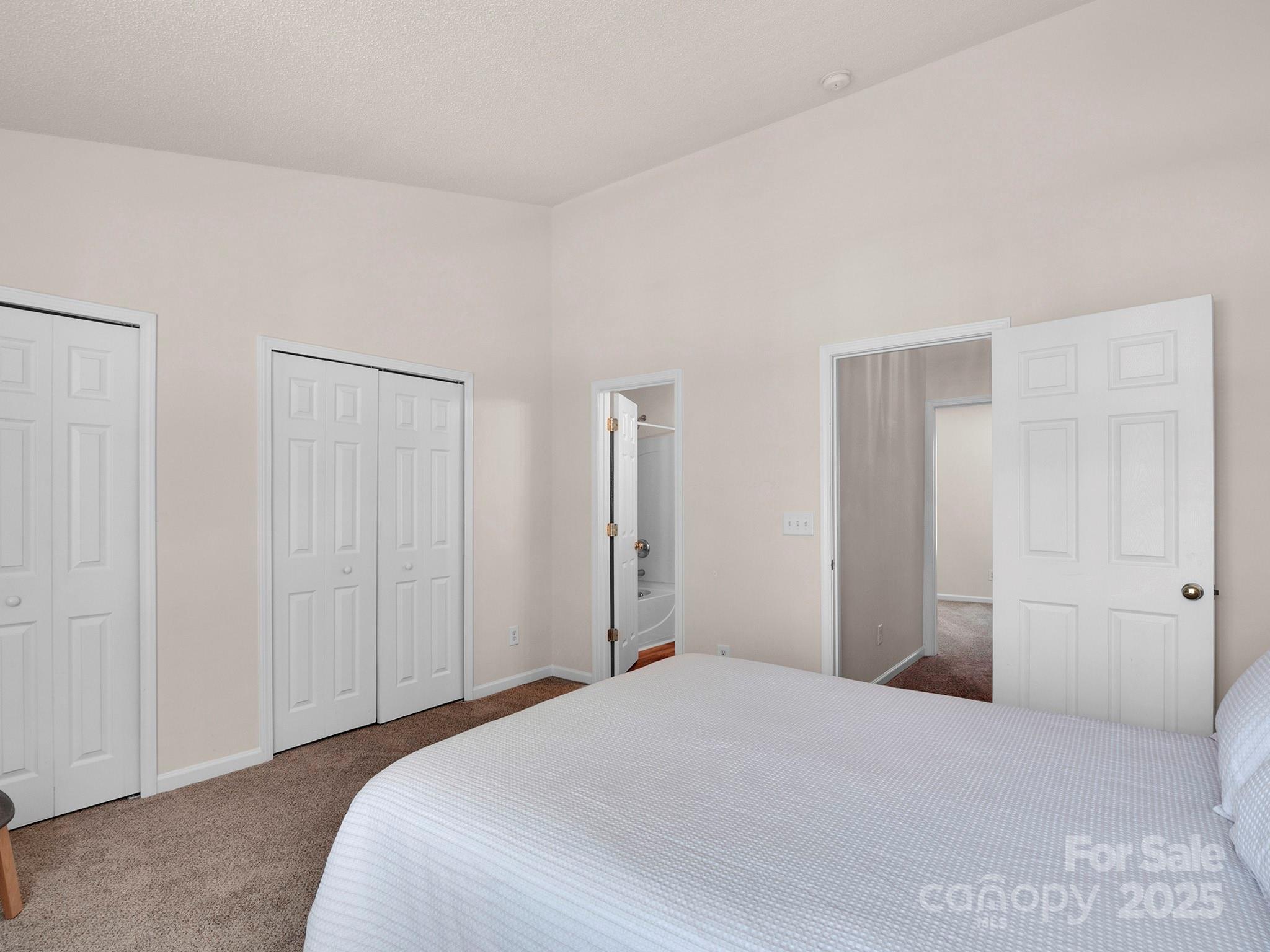 3209 Blythe Ridge Court Charlotte, NC 28213 - Photo 15 of 31 a bedroom with a bed and a bathroom