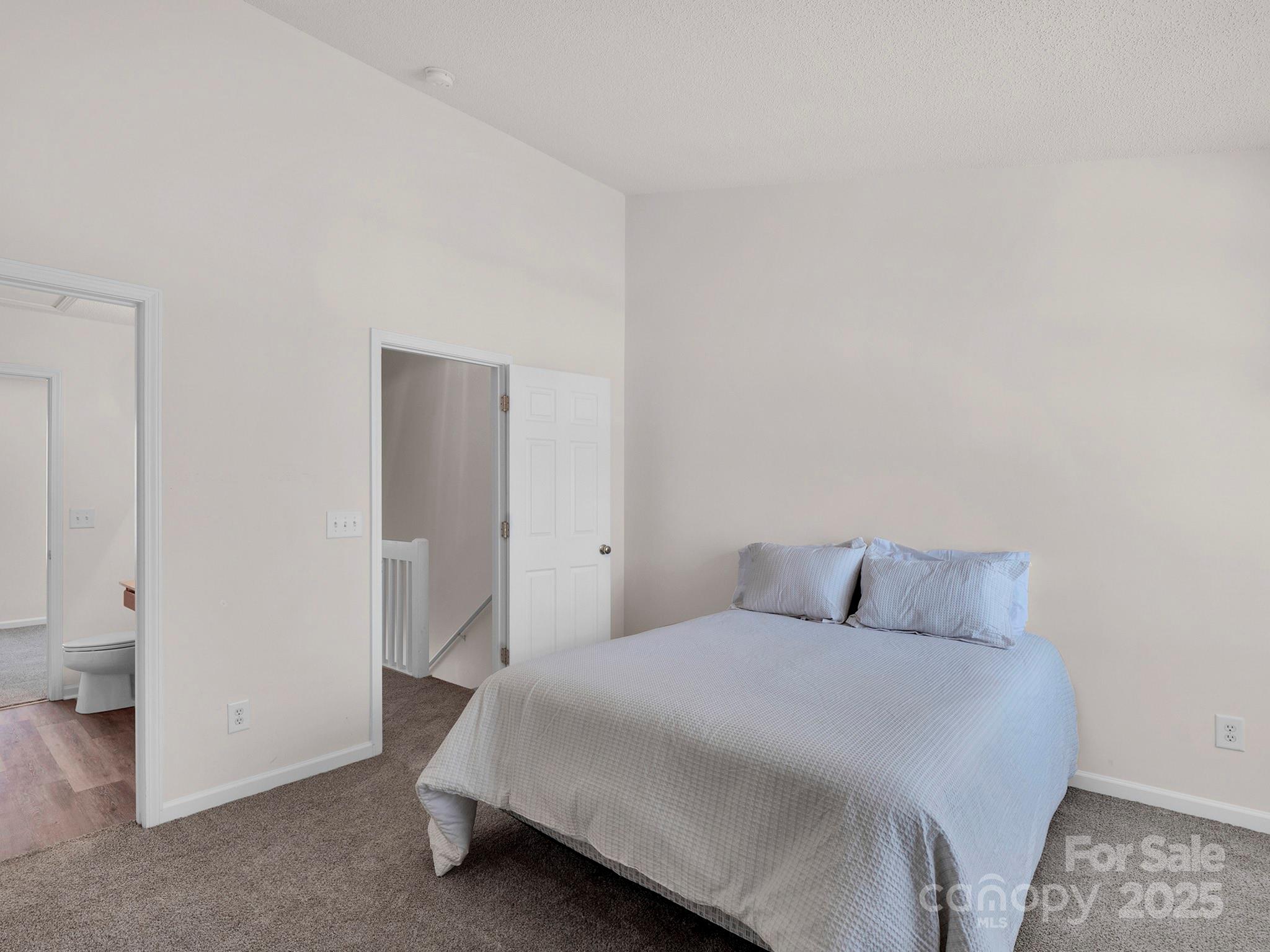 3209 Blythe Ridge Court Charlotte, NC 28213 - Photo 16 of 31 a bedroom with a bed and closet