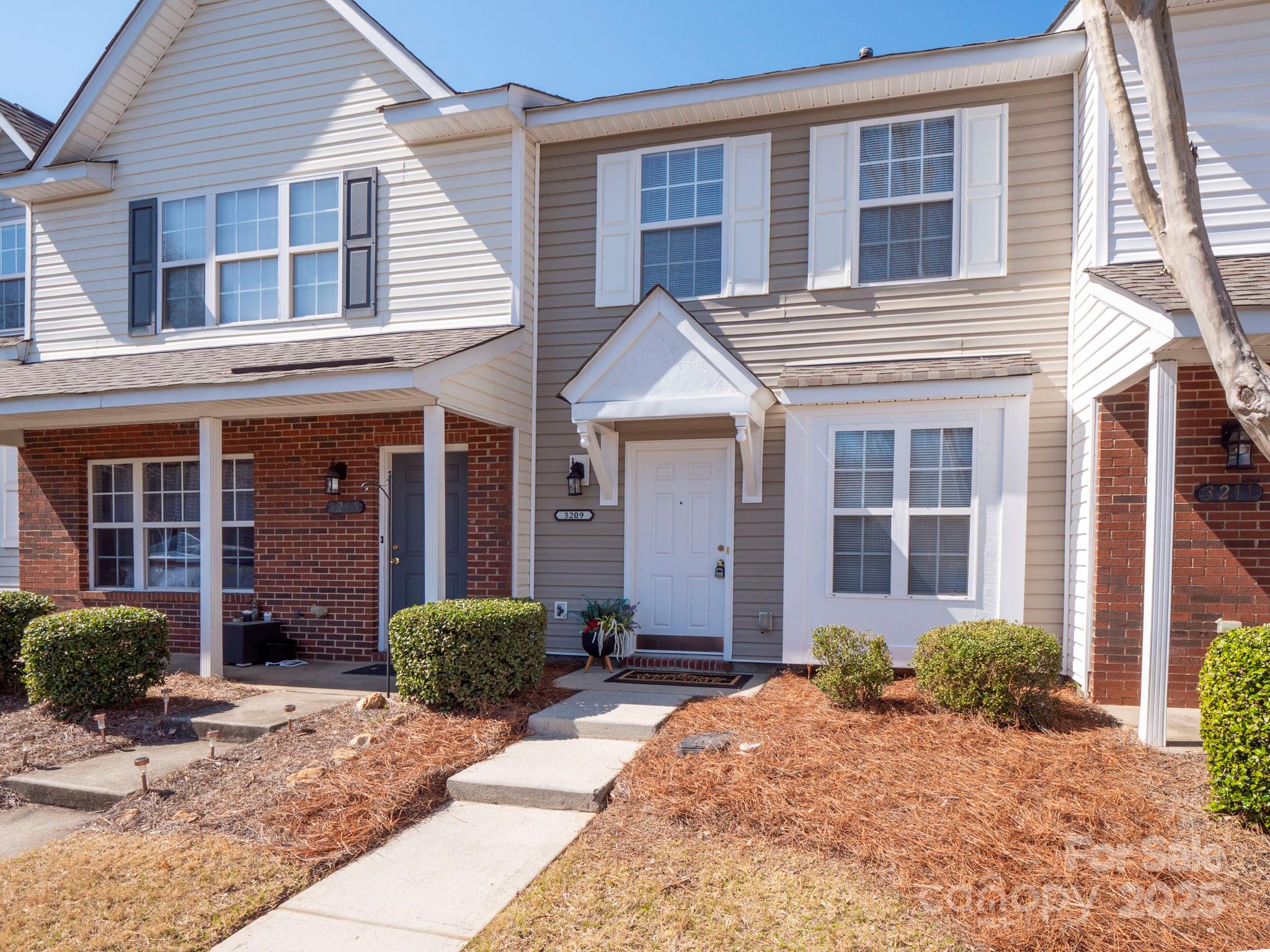 3209 Blythe Ridge Court Charlotte, NC 28213 - Photo 2 of 31 a front view of a house with yard and glass windows