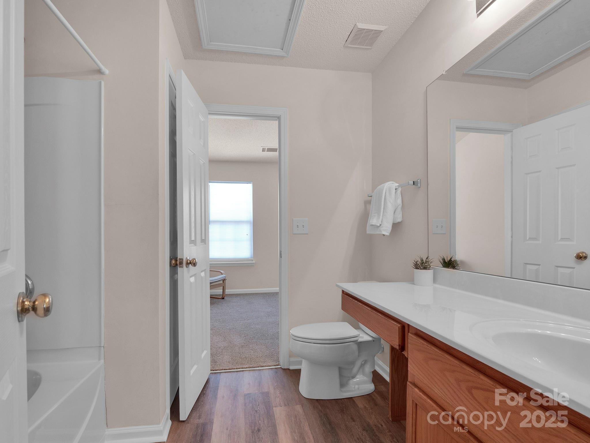 3209 Blythe Ridge Court Charlotte, NC 28213 - Photo 22 of 31 a bathroom with a sink and a toilet