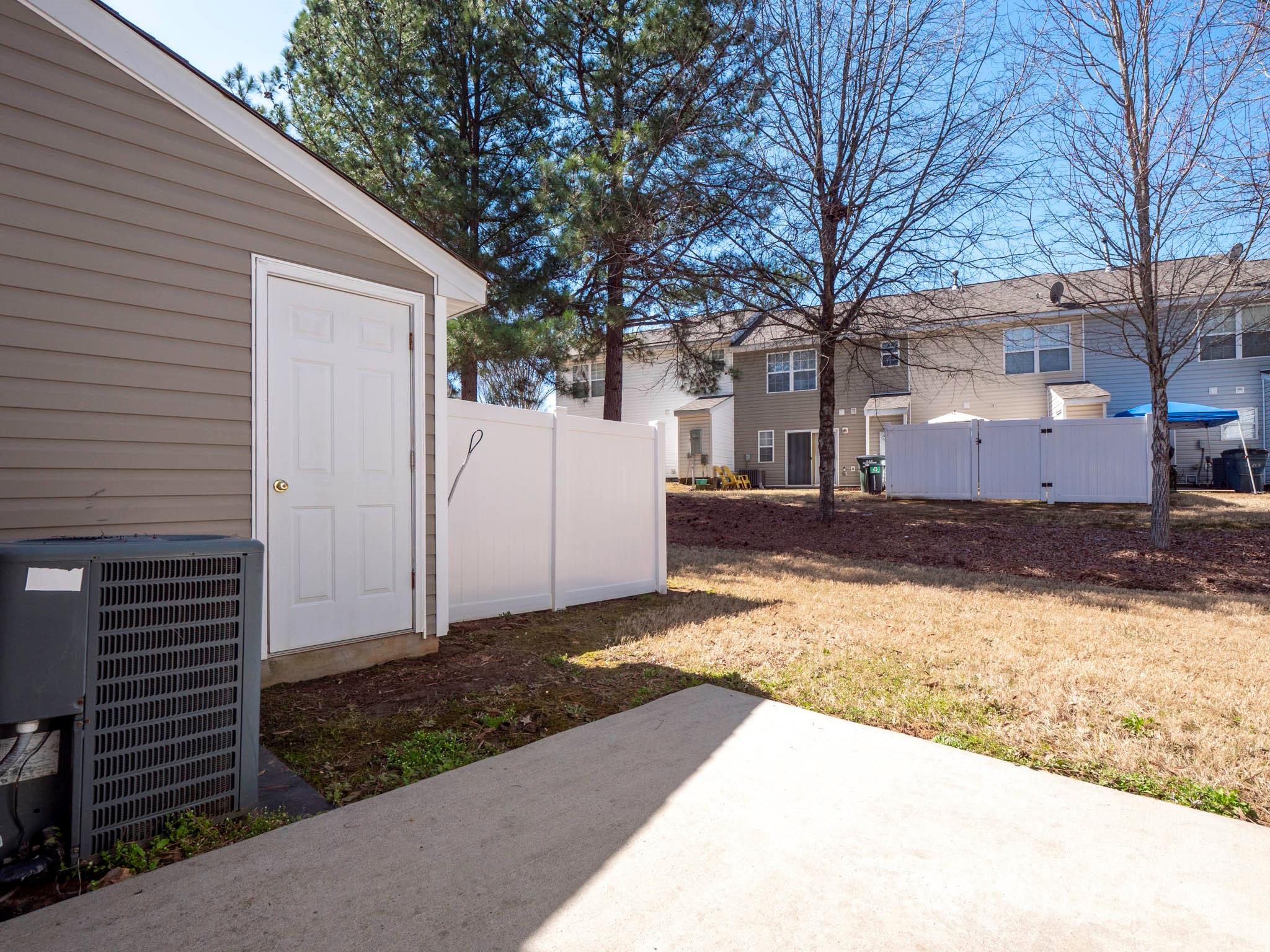 3209 Blythe Ridge Court Charlotte, NC 28213 - Photo 23 of 31 a view of a house with a yard covered in snow