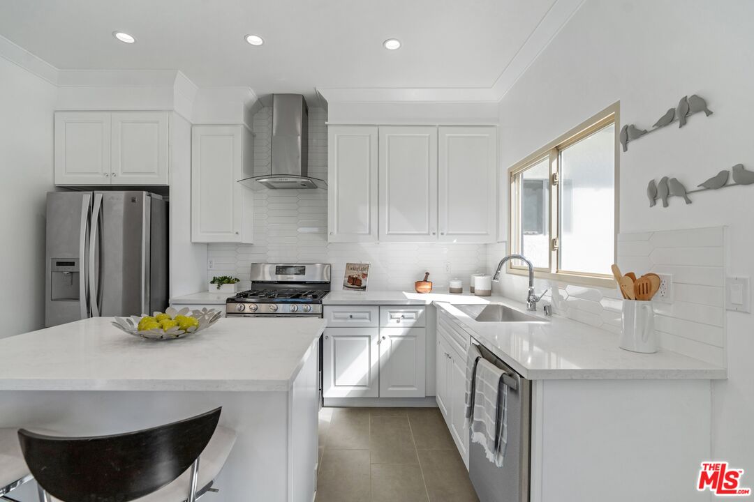3034 Glen Avenue Altadena, CA 91001 - Photo 11 of 25 a kitchen with a sink a stove and refrigerator