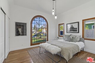 3034 Glen Avenue Altadena, CA 91001 - Photo 13 of 25 a bedroom with a large bed and a window