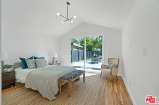 3034 Glen Avenue Altadena, CA 91001 - Photo 18 of 25 a bedroom with a bed and wooden floor