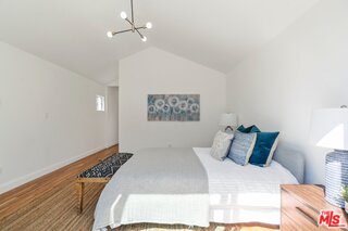 3034 Glen Avenue Altadena, CA 91001 - Photo 19 of 25 a bedroom with a bed and a painting on the wall