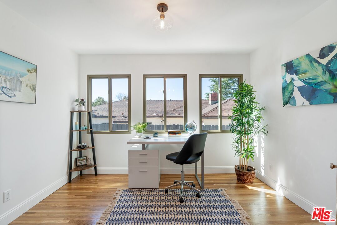 3034 Glen Avenue Altadena, CA 91001 - Photo 8 of 25 a living room with furniture and a potted plant