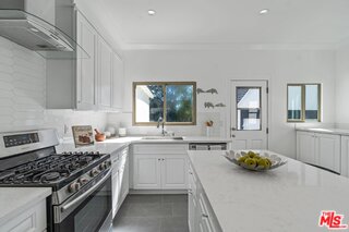 3034 Glen Avenue Altadena, CA 91001 - Photo 10 of 25 a kitchen with a sink a stove and cabinets