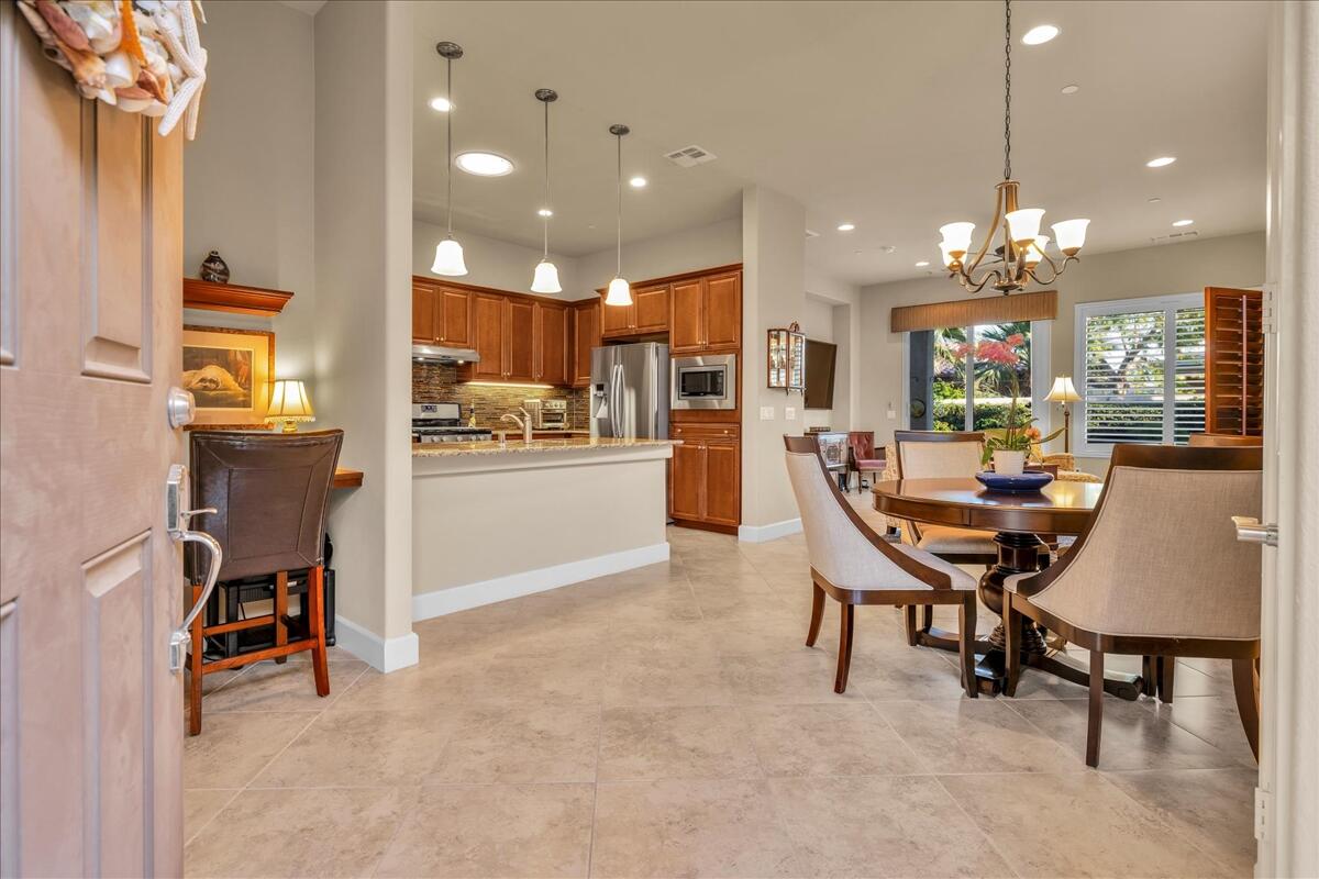 39048 Camino Orquesta Indio, CA 92203 - Photo 8 of 62 a view of a dining room with furniture and chandelier