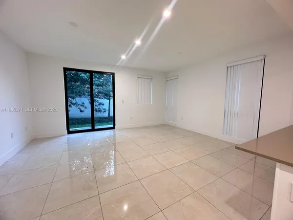 a view of an empty room with a window