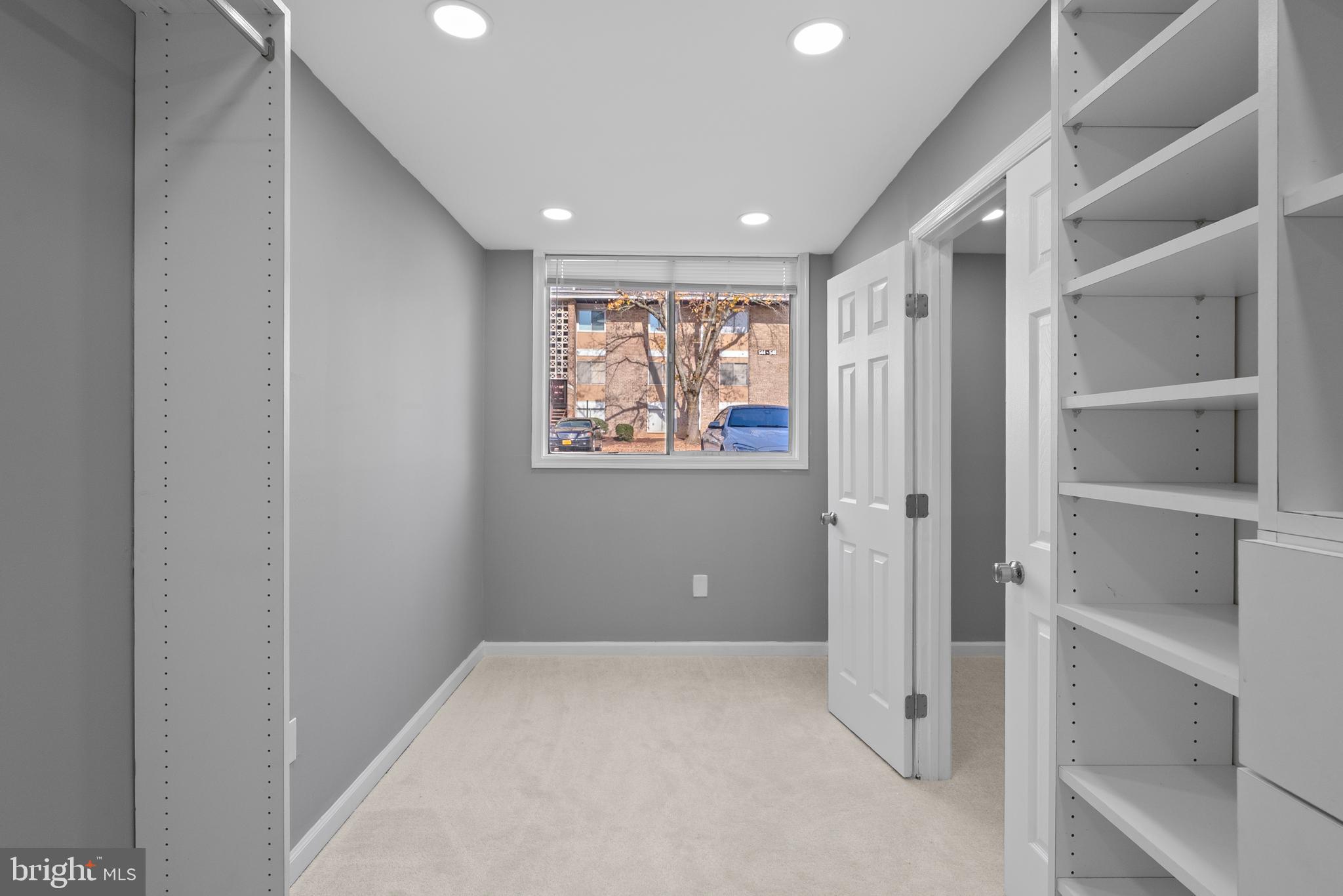 542 Wilson Bridge Drive, Unit 6743 B2 Oxon Hill, MD 20745 - Photo 19 of 27 a view of an empty room with a window