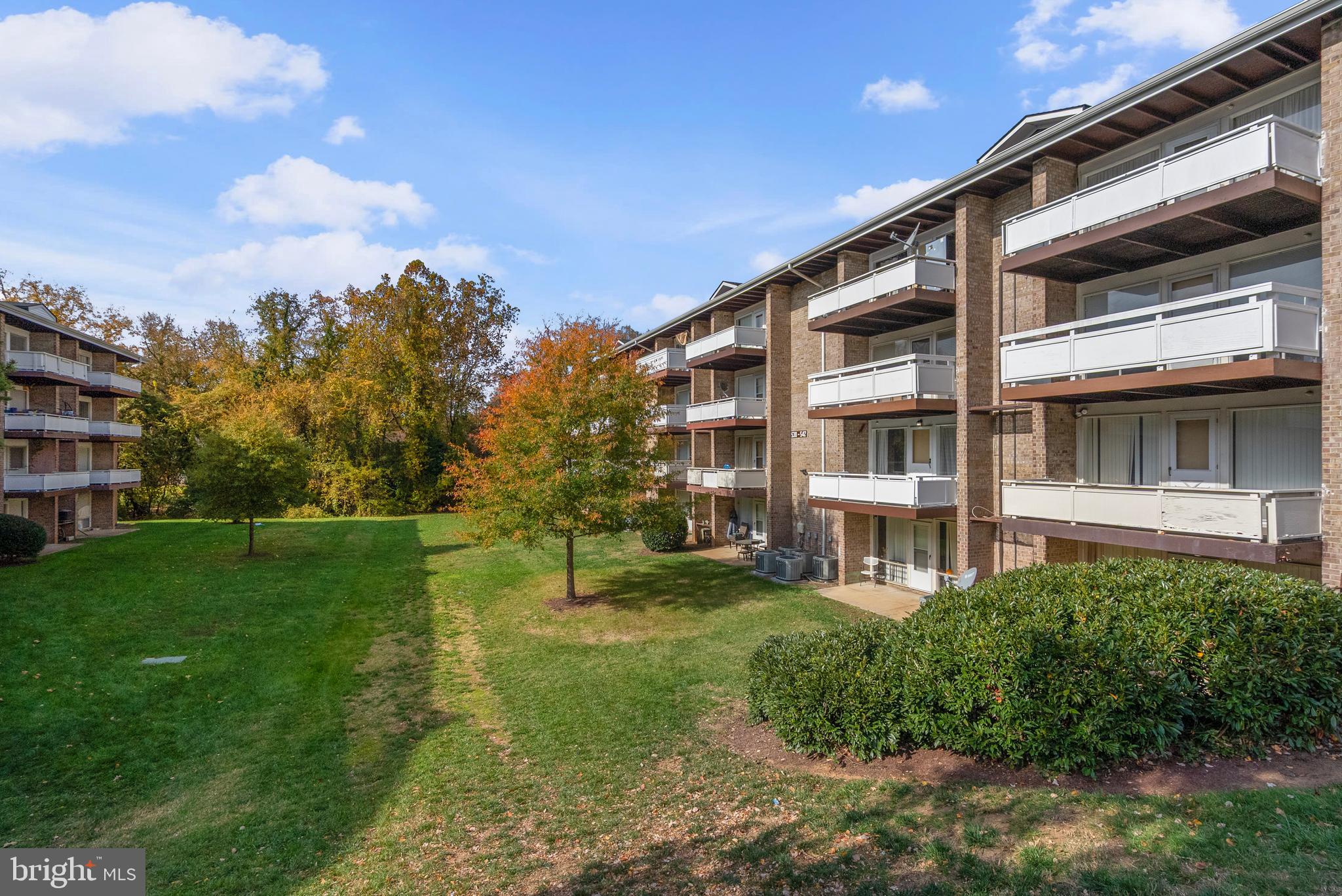 542 Wilson Bridge Drive, Unit 6743 B2 Oxon Hill, MD 20745 - Photo 27 of 27 a view of a building with a yard