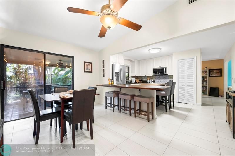 1088 Raintree Drive Palm Beach Gardens, FL 33410 - Photo 12 of 36 a view of a dining room and livingroom view