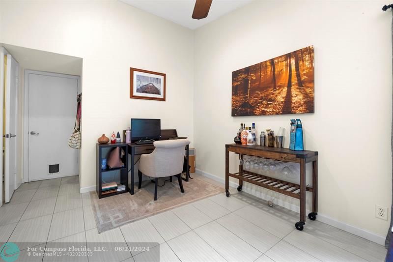 1088 Raintree Drive Palm Beach Gardens, FL 33410 - Photo 14 of 36 a reading room with furniture and a window