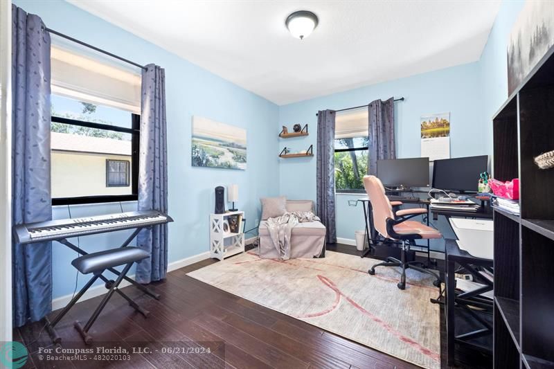 1088 Raintree Drive Palm Beach Gardens, FL 33410 - Photo 20 of 36 a view of a workspace with furniture and a window