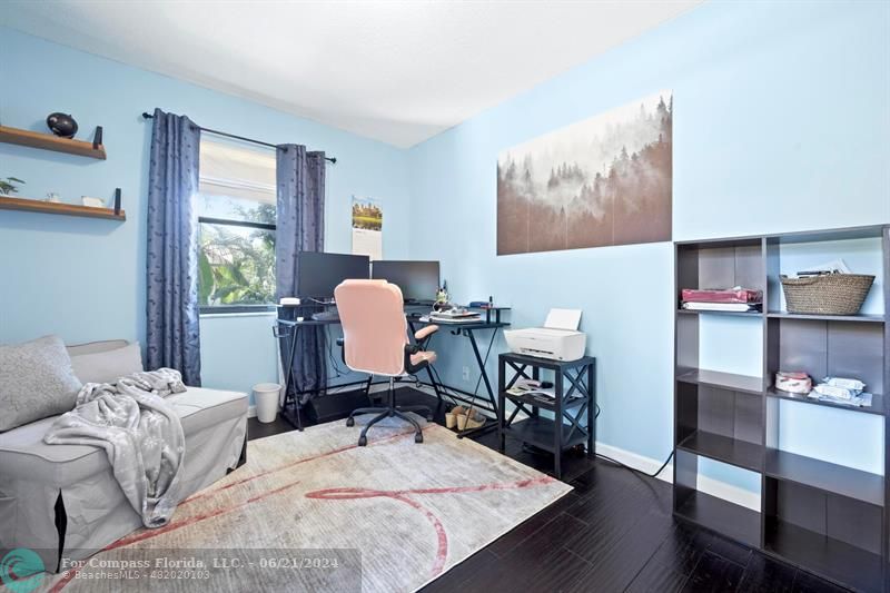 1088 Raintree Drive Palm Beach Gardens, FL 33410 - Photo 21 of 36 a view of a workspace with furniture and a window