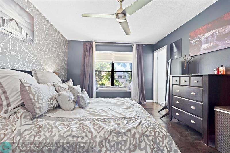 1088 Raintree Drive Palm Beach Gardens, FL 33410 - Photo 24 of 36 a bed room with a bed and a window