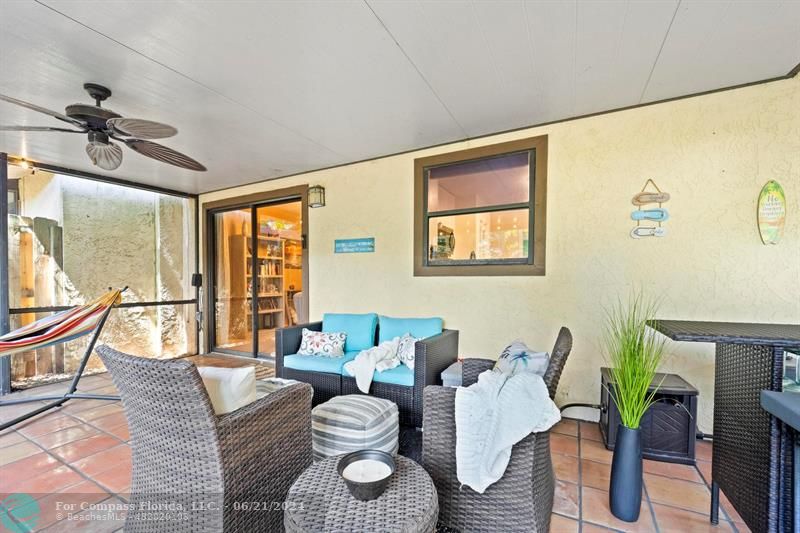 1088 Raintree Drive Palm Beach Gardens, FL 33410 - Photo 30 of 36 a living room with furniture and a window