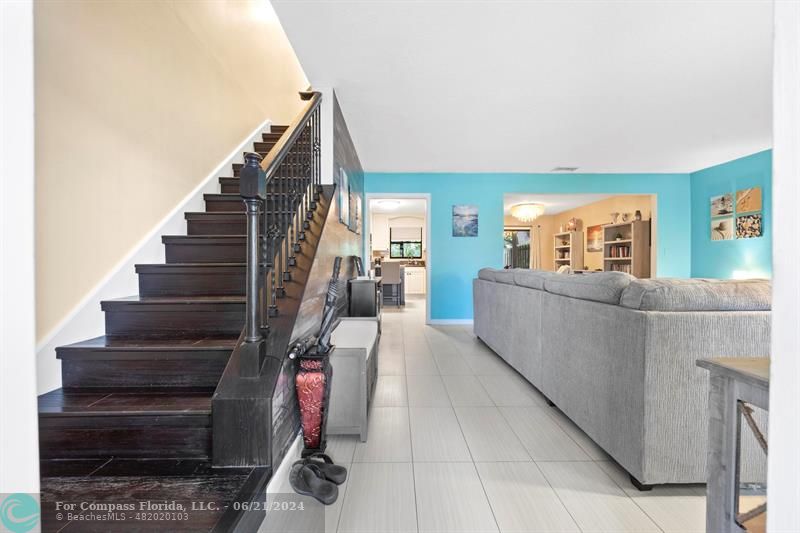 1088 Raintree Drive Palm Beach Gardens, FL 33410 - Photo 3 of 36 a living room with furniture and stairs