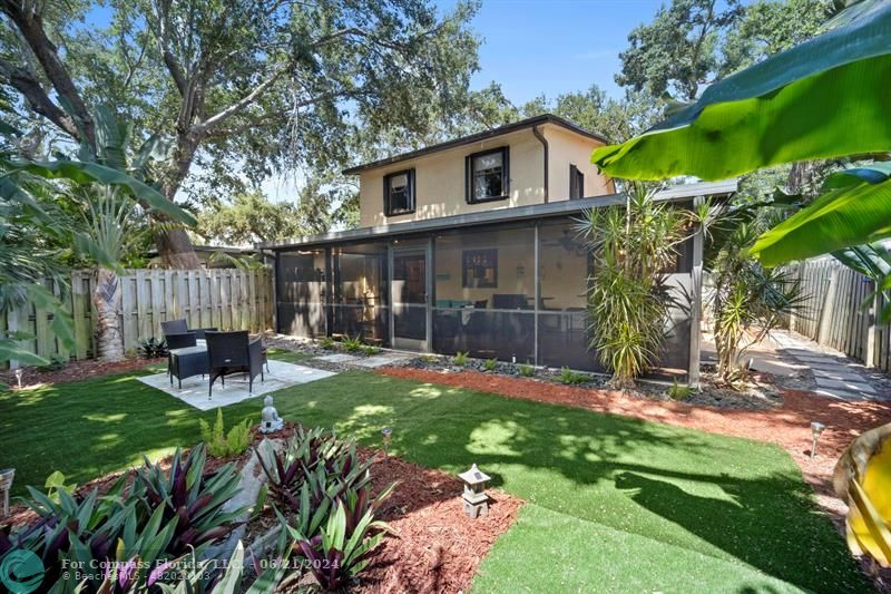 1088 Raintree Drive Palm Beach Gardens, FL 33410 - Photo 33 of 36 a view of a chair and table in backyard of the house