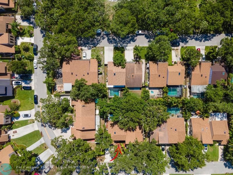 1088 Raintree Drive Palm Beach Gardens, FL 33410 - Photo 34 of 36 an aerial view of a house with a yard and garden
