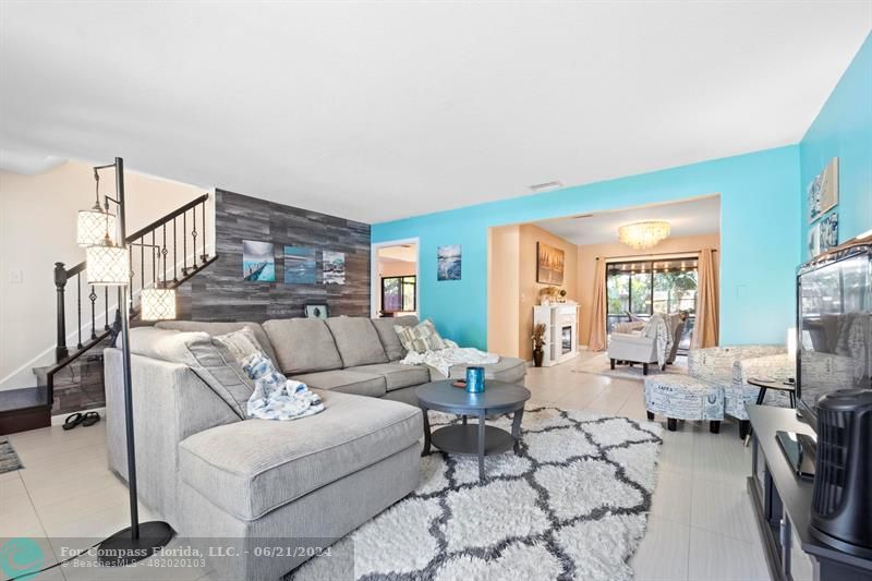 1088 Raintree Drive Palm Beach Gardens, FL 33410 - Photo 6 of 36 a living room with furniture dining table and a large window