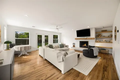 a living room with furniture fireplace and a flat screen tv