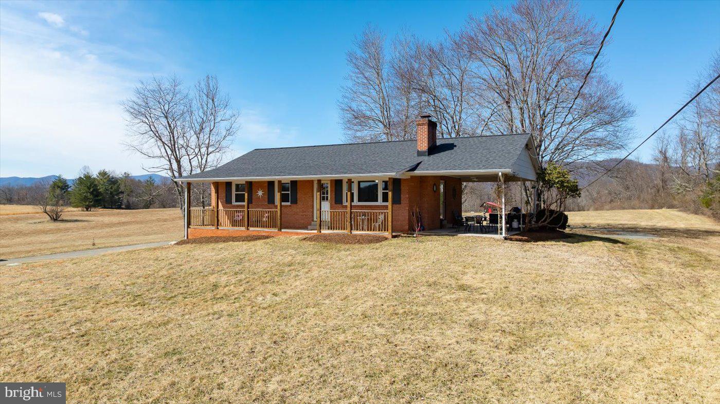 297 Tiger Valley Road Washington, VA 22747 - Photo 2 of 39 a front view of a house with a yard