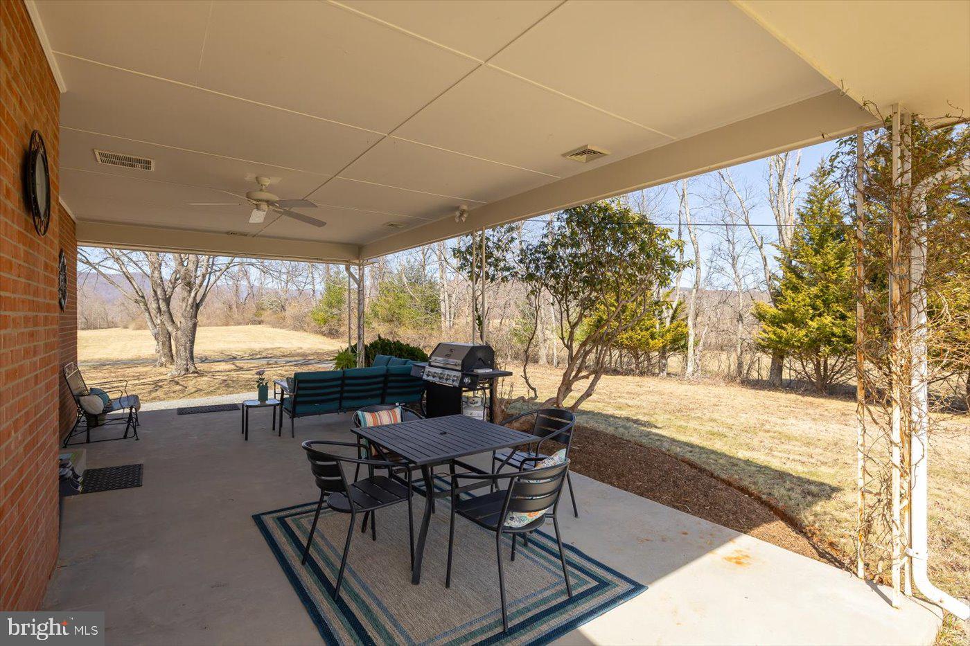 297 Tiger Valley Road Washington, VA 22747 - Photo 25 of 39 a dining room with furniture and a floor to ceiling window