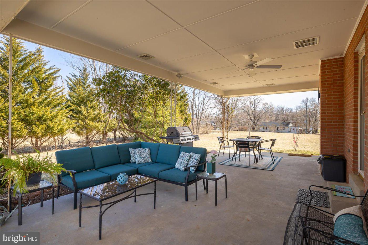 297 Tiger Valley Road Washington, VA 22747 - Photo 26 of 39 a living room with furniture and a floor to ceiling window