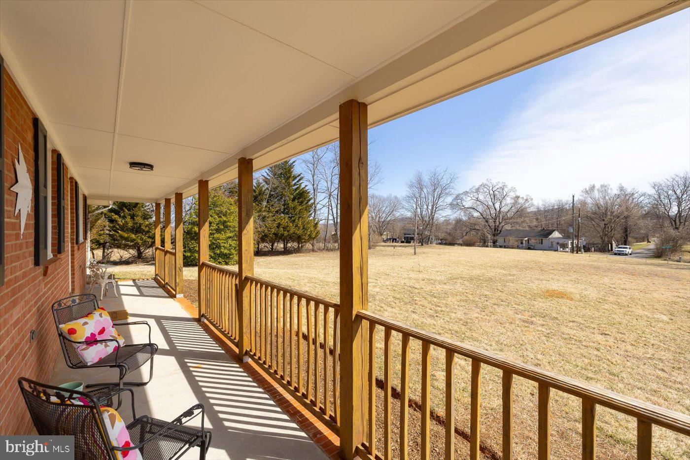 297 Tiger Valley Road Washington, VA 22747 - Photo 33 of 39 a view of a porch with wooden floor and furniture