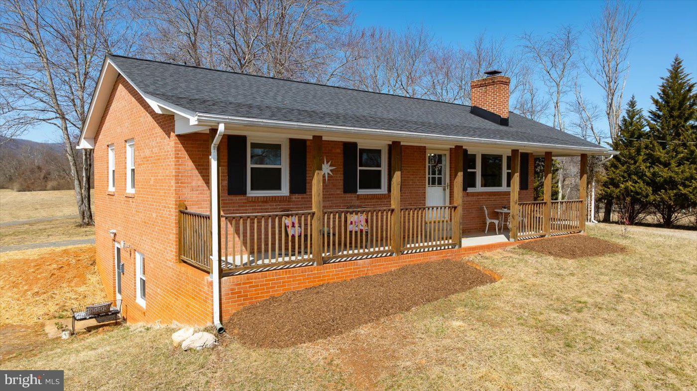 297 Tiger Valley Road Washington, VA 22747 - Photo 4 of 39 a front view of a house with a outdoor space