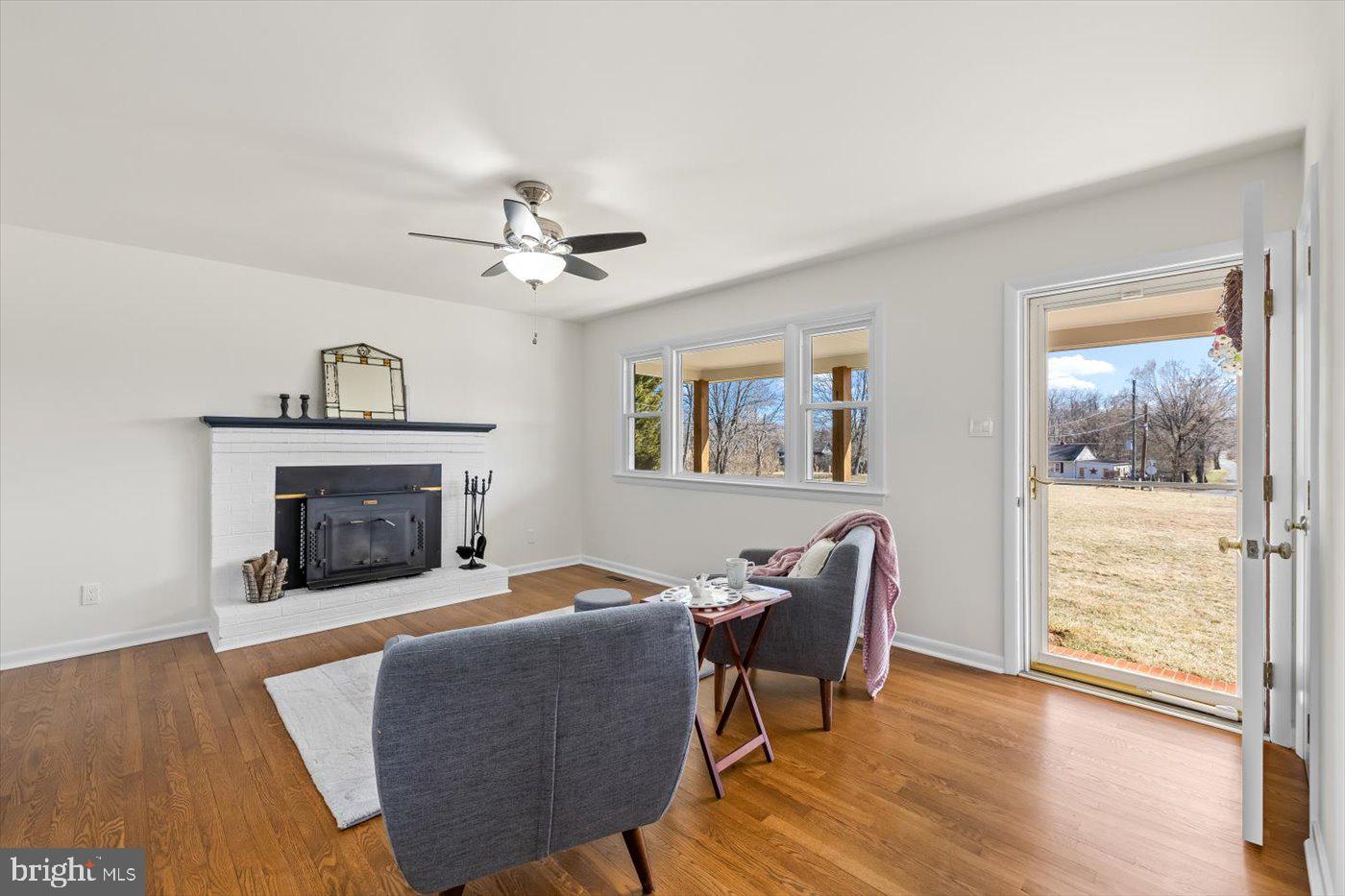 297 Tiger Valley Road Washington, VA 22747 - Photo 5 of 39 a living room with furniture and a fireplace