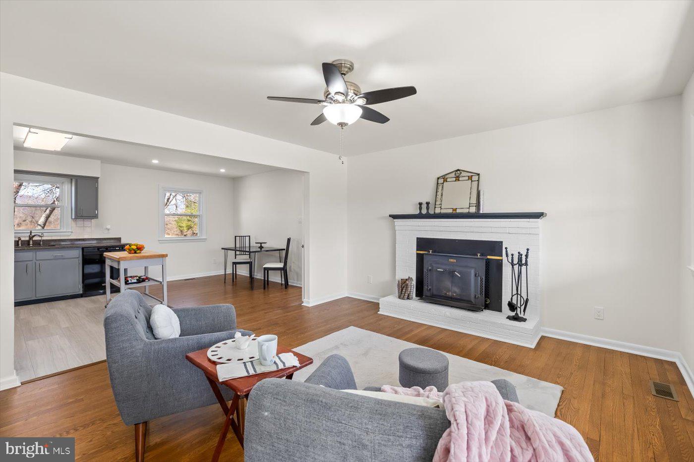 297 Tiger Valley Road Washington, VA 22747 - Photo 6 of 39 a living room with furniture a fireplace and a chandelier