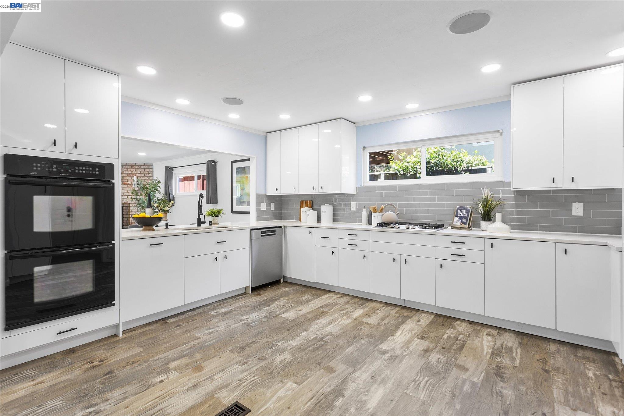 16683 Kildare Road Castro Valley, CA 94546 - Photo 22 of 77 a kitchen with granite countertop cabinets stainless steel appliances a sink and a window