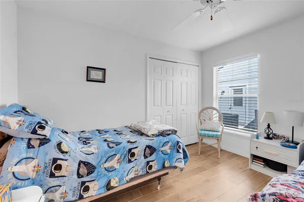 a bedroom with a bed and a dresser