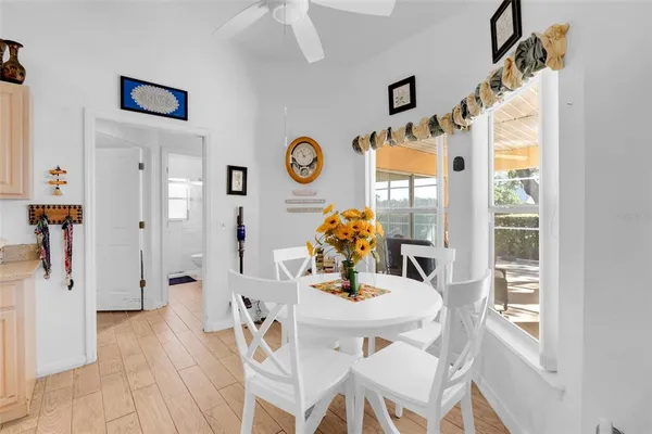 a kitchen with refrigerator and cabinets